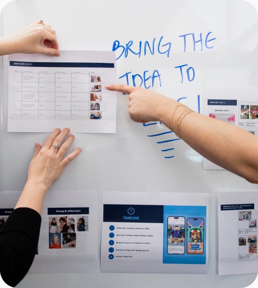 A strategist mapping ideas on a whiteboard.