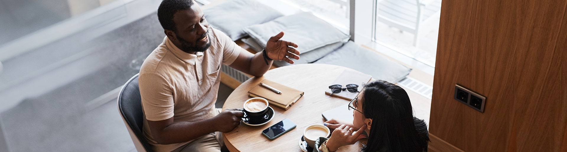 Business partners discuss options at a coffee shop