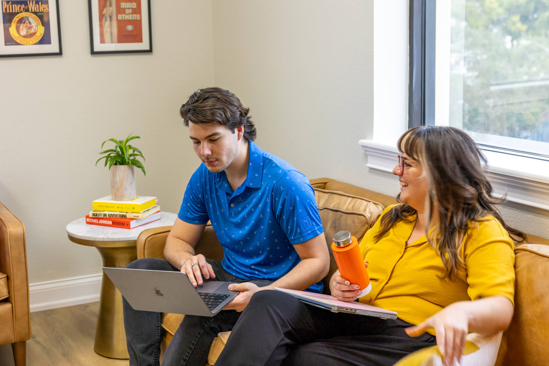Co-workers collaborating on couch